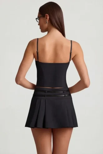 Mini-jupe plissée à taille basse et ceinture Velora, en noir
