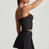 Mini-jupe plissée à taille basse et ceinture Velora, en noir Mini-jupe plissée à taille basse et ceinture Velora, en noir