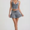 Mini-jupe plissée taille basse Laika en bleu clair Mini-jupe plissée taille basse Laika en bleu clair