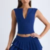 Mini-jupe plissée à volants et taille basse Nada, couleur bleu marine Mini-jupe plissée à volants et taille basse Nada, couleur bleu marine