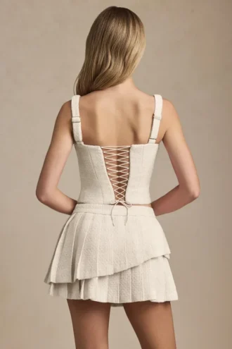 Mini-jupe plissée à volants et taille basse Nada, couleur ivoire