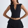 Mini-jupe plissée à volants et taille basse Nada, en noir
