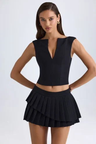 Mini-jupe plissée à volants et taille basse Nada, en noir