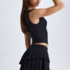 Mini-jupe plissée à volants et taille basse Nada, en noir