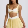 Mini-jupe-short plissée Soft Active à croisement, couleur citron Mini-jupe-short plissée Soft Active à croisement, couleur citron