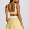 Mini-jupe-short plissée Soft Active à croisement, couleur citron Mini-jupe-short plissée Soft Active à croisement, couleur citron
