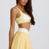 Mini-jupe-short plissée Soft Active à croisement, couleur citron Mini-jupe-short plissée Soft Active à croisement, couleur citron