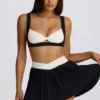 Mini-jupe-short plissée Soft Active Crossover en noir Mini-jupe-short plissée Soft Active Crossover en noir