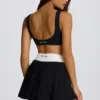 Mini-jupe-short plissée Soft Active Crossover en noir Mini-jupe-short plissée Soft Active Crossover en noir