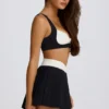Mini-jupe-short plissée Soft Active Crossover en noir Mini-jupe-short plissée Soft Active Crossover en noir