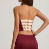 Mini-jupe taille basse Carola en satin avec nœud, couleur rouge vin Mini-jupe taille basse Carola en satin avec nœud, couleur rouge vin