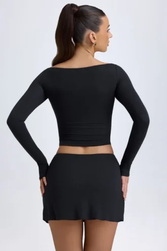 Mini-jupe taille basse Dalla en modal avec boutons, couleur noire