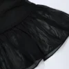 Mini-jupe taille moyenne à volants et détails métalliques Tobago en noir Mini-jupe taille moyenne à volants et détails métalliques Tobago en noir