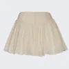 Mini-jupe Thia à nœud en broderie anglaise ivoire Mini-jupe Thia à nœud en broderie anglaise ivoire