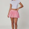 Mini-jupe Thia à nœud et broderie anglaise, rose pâle Mini-jupe Thia à nœud et broderie anglaise, rose pâle
