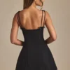 Mini-robe A-line plissée avec nœud Cressida en noir