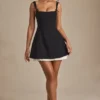 Mini-robe A-line plissée avec nœud Cressida en noir