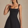 Mini-robe A-line plissée avec nœud Cressida en noir