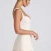 Mini-robe corset Cassandra à volants et boutons, couleur ivoire Mini-robe corset Cassandra à volants et boutons, couleur ivoire