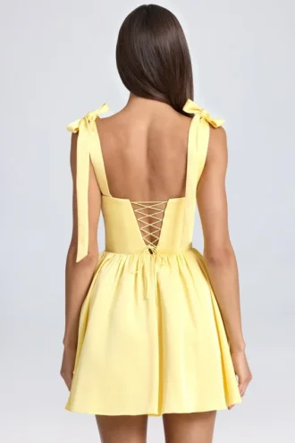 Mini-robe corset drapée Bellamy en Lemon Sherbet