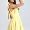 Mini-robe corset drapée Bellamy en Lemon Sherbet Mini-robe corset drapée Bellamy en Lemon Sherbet