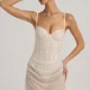 Mini-robe corset drapée semi-transparente avec ornements Connie, en blanc