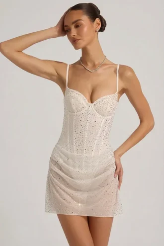 Mini-robe corset drapée semi-transparente avec ornements Connie, en blanc