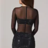 Mini-robe à manches longues et col haut Noel, en tulle noir orné Mini-robe à manches longues et col haut Noel, en tulle noir orné