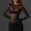 Mini-robe à manches longues et col haut Noel, en tulle noir orné Mini-robe à manches longues et col haut Noel, en tulle noir orné