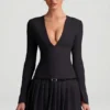 Mini-robe plissée à manches longues Fiorella en noir Mini-robe plissée à manches longues Fiorella en noir