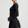 Mini-robe plissée à manches longues Fiorella en noir Mini-robe plissée à manches longues Fiorella en noir