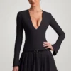 Mini-robe plissée à manches longues Fiorella en noir Mini-robe plissée à manches longues Fiorella en noir