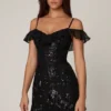 Mini-robe trapèze Jacira à lacets et ornements, en noir Mini-robe trapèze Jacira à lacets et ornements, en noir