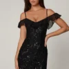 Mini-robe trapèze Jacira à lacets et ornements, en noir Mini-robe trapèze Jacira à lacets et ornements, en noir