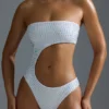 Oh Polly Swim : Maillot de bain 1 pièce échancré et orné de strass HOTFIX Edition, en blanc Oh Polly Swim : Maillot de bain 1 pièce échancré et orné de strass HOTFIX Edition, en blanc