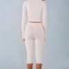 Pantalon capri Selene en maille à taille mi-haute, couleur ivoire Pantalon capri Selene en maille à taille mi-haute, couleur ivoire