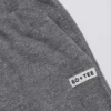 Pantalon de jogging large taille basse en coton texturé à boutons, gris foncé Pantalon de jogging large taille basse en coton texturé à boutons, gris foncé