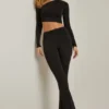 Pantalon évasé à taille mi-haute et drapé asymétrique Mairead en noir Pantalon évasé à taille mi-haute et drapé asymétrique Mairead en noir