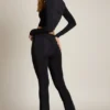 Pantalon évasé à taille mi-haute et drapé asymétrique Mairead en noir Pantalon évasé à taille mi-haute et drapé asymétrique Mairead en noir