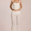 Pantalon évasé taille moyenne en dentelle transparente Calista, couleur ivoire Pantalon évasé taille moyenne en dentelle transparente Calista, couleur ivoire