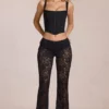 Pantalon évasé taille moyenne en dentelle transparente Calista, noir Pantalon évasé taille moyenne en dentelle transparente Calista, noir