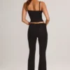Pantalon évasé taille moyenne Patsy en modal noir Pantalon évasé taille moyenne Patsy en modal noir