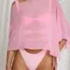 Poncho transparent Zarayah en rose bonbon Poncho transparent Zarayah en rose bonbon