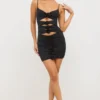 Robe Aniela en jersey fluide avec détails roses et découpes, couleur noir Robe Aniela en jersey fluide avec détails roses et découpes, couleur noir