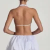 Robe Cece à ourlet bouffant et découpes ornées, en blanc Robe Cece à ourlet bouffant et découpes ornées, en blanc
