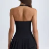 Robe courte asymétrique à volants et dos nu Rosaria en noir Robe courte asymétrique à volants et dos nu Rosaria en noir