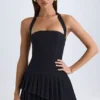Robe courte asymétrique à volants et dos nu Rosaria en noir Robe courte asymétrique à volants et dos nu Rosaria en noir