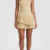 Robe courte asymétrique à volants et dos nu Rosaria, jaune pastel Robe courte asymétrique à volants et dos nu Rosaria, jaune pastel