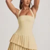 Robe courte asymétrique à volants et dos nu Rosaria, jaune pastel Robe courte asymétrique à volants et dos nu Rosaria, jaune pastel