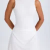 Robe courte drapée à dos nu Shirin en blanc